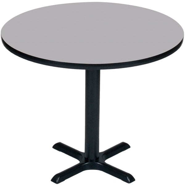 A Correll round table with a black base and grey granite top.