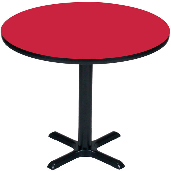 a red table with a black base