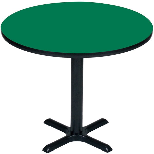 A Correll round table with a green top and black base.