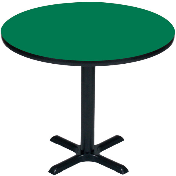 A Correll table with a green round top and black base.