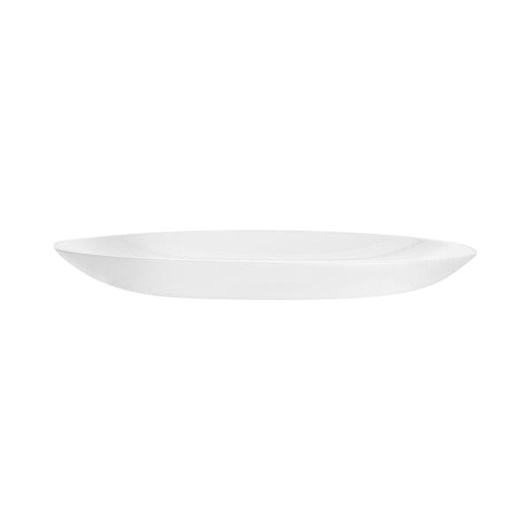 An Arcoroc white round rimless opal glass dessert plate on a white background.