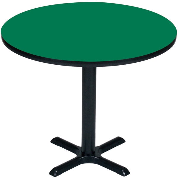 A Correll round green table with a black base.