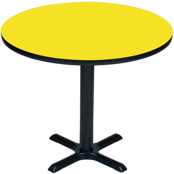 A Correll round yellow high pressure table with a black base.