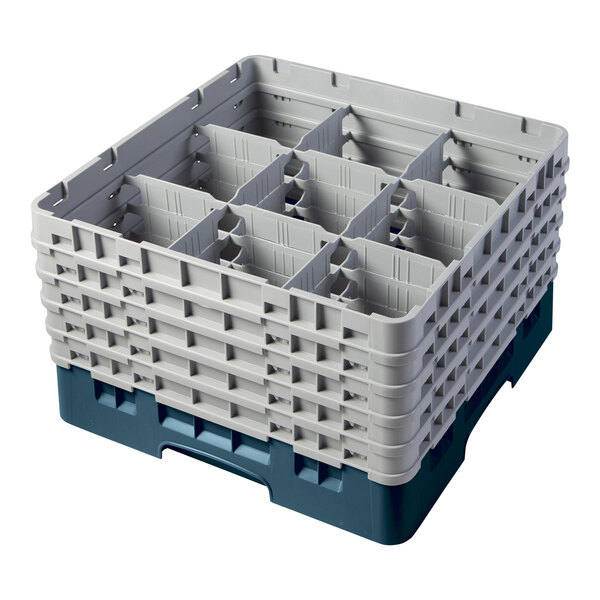 A teal plastic Cambro glass rack with 9 compartments and 5 extenders.