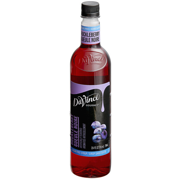 A bottle of DaVinci Gourmet Sugar Free Huckleberry Fruit Syrup with a label.