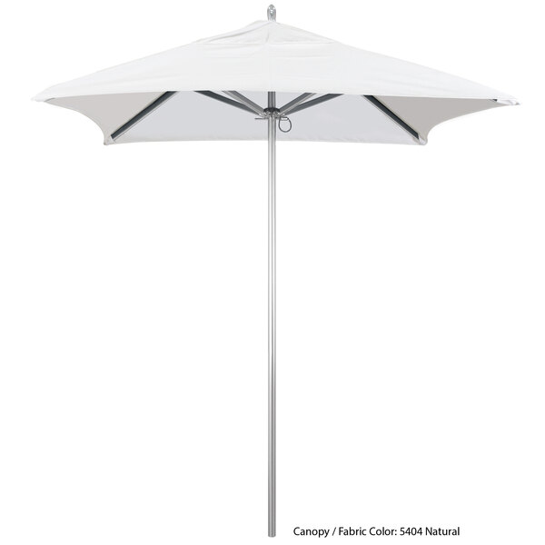 A white California Umbrella with a metal pole and a white Sunbrella canopy.