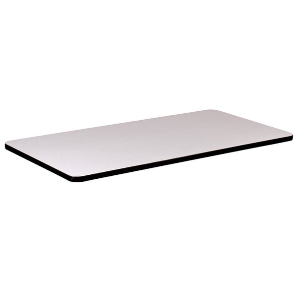 A white rectangular table top with black edges.