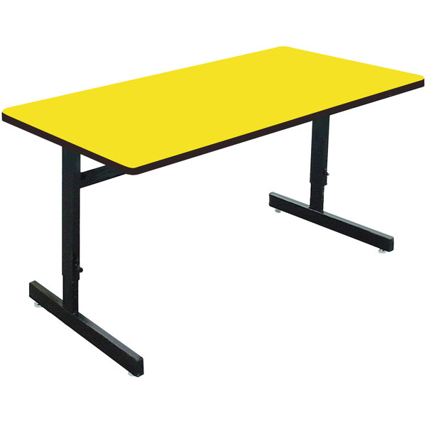 a yellow rectangular table with black legs