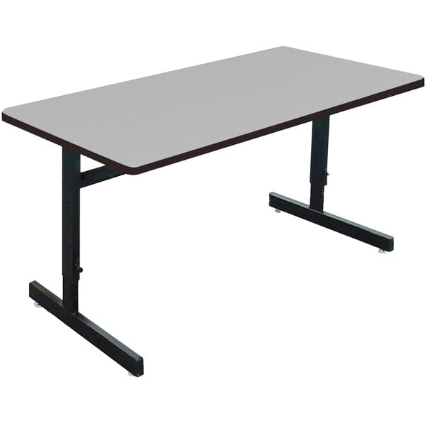 A rectangular gray granite Correll computer table with black legs.