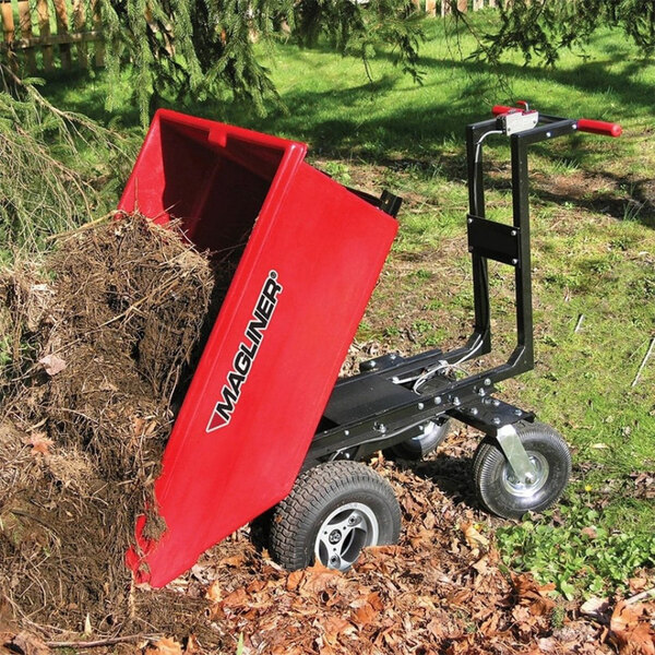 A red Magliner motorized hopper cart with dirt in it.