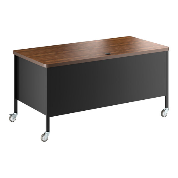 A black and walnut mobile double pedestal teacher's desk with a wood top and four caster wheels.
