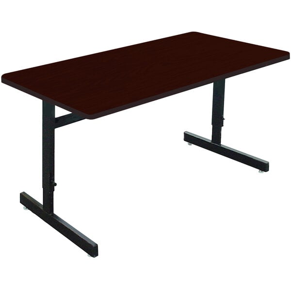 A mahogany rectangular table with black legs.