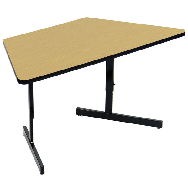 A Correll trapezoid computer table with a black base and a yellow top.