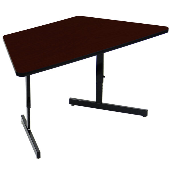 A Correll mahogany trapezoid computer table with a black base.