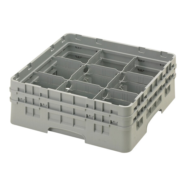 A grey plastic Cambro glass rack with 9 compartments and extenders.