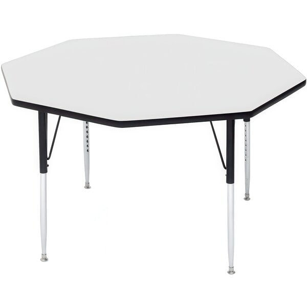 A white hexagon-shaped Correll activity table with black legs.