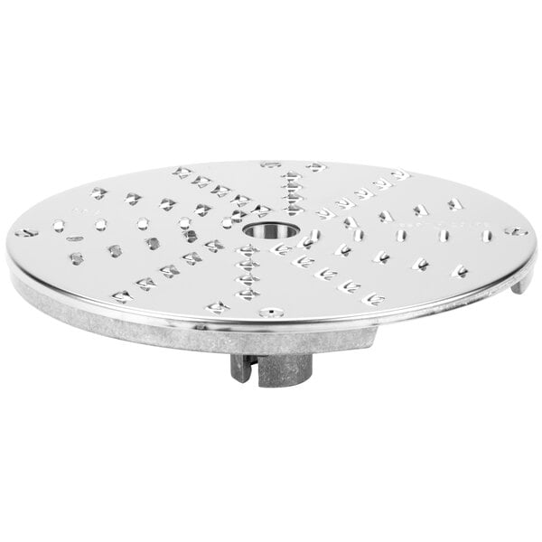 A silver Robot Coupe 1/8" grating / shredding disc with holes in it.