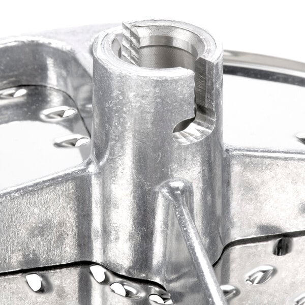 A Robot Coupe 1/8" grating/shredding disc with a metal finish.