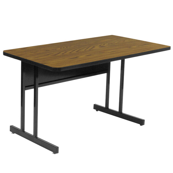 a brown desk with black metal legs