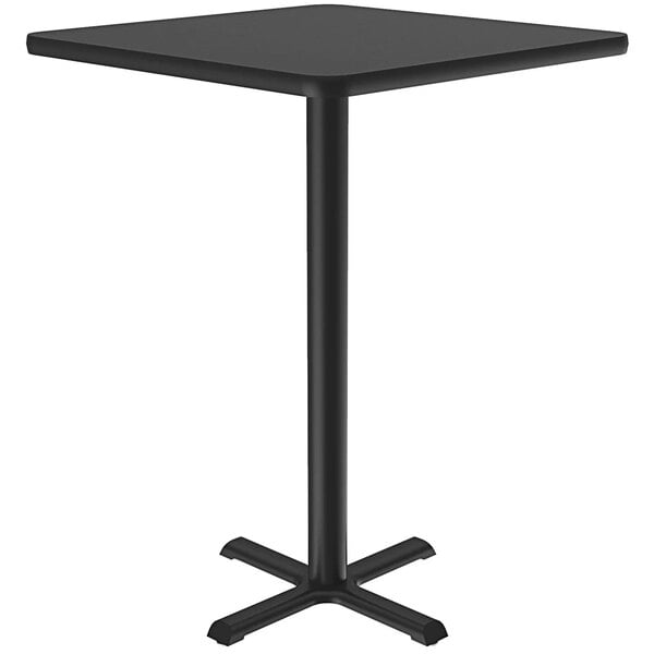 A Correll black square table with a metal bar height base.