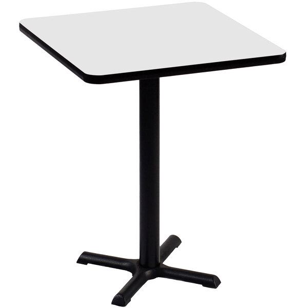 a white square table with a black base