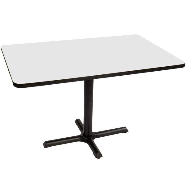 A white rectangular Correll table with a black base.