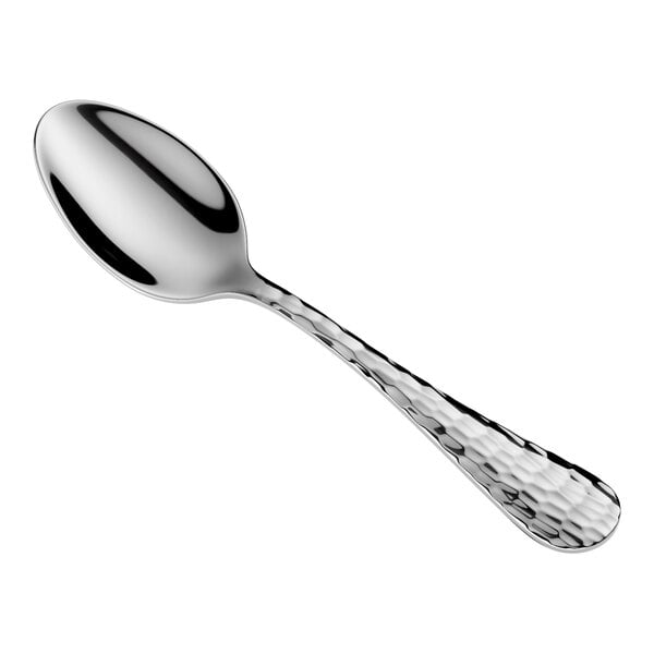 A shiny metal spoon with a textured handle, shown on a white background.