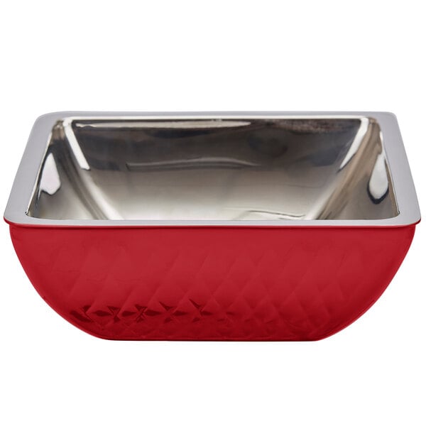 A red Bon Chef square bowl with a silver rim.