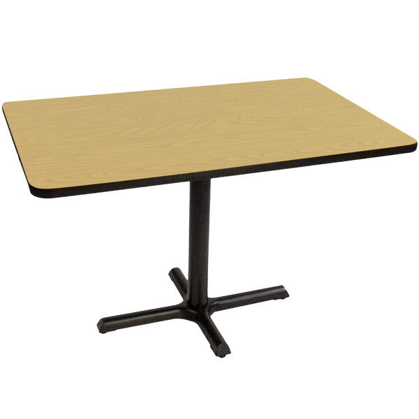 A Correll rectangular table with a black base and a fusion maple top.