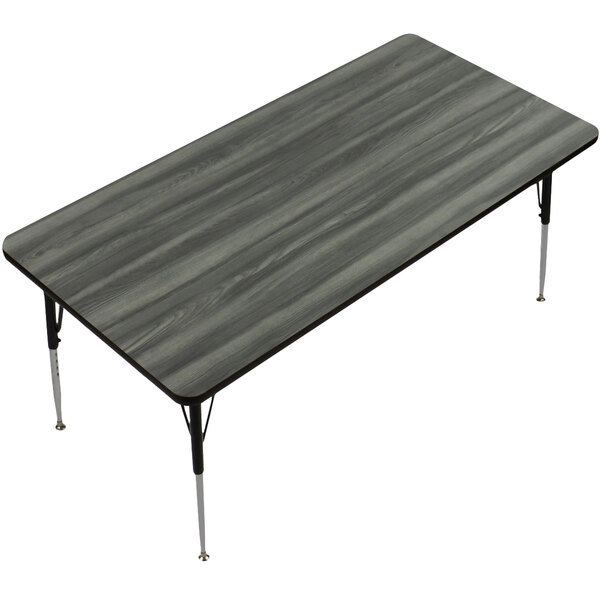 A rectangular Correll activity table with metal legs and a New England driftwood finish top.