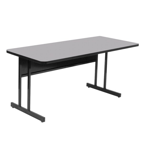 A rectangular gray granite Correll desk with black legs.