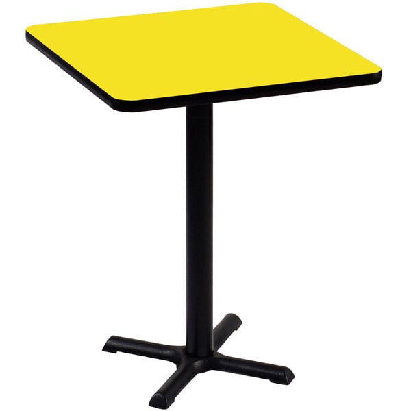 A yellow square Correll table with black base.