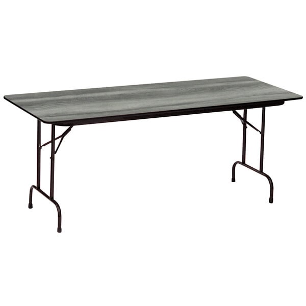 A Correll rectangular folding table with New England Driftwood finish.