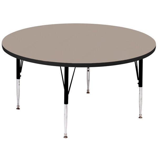 A Correll round activity table with black legs and a black top.