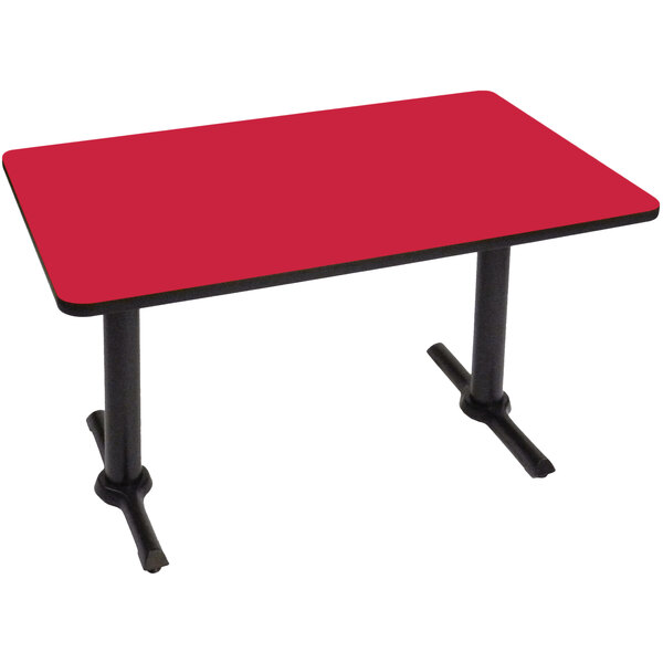 A red rectangular Correll table with black T bases.