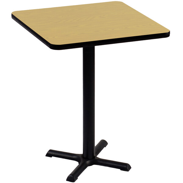 A Correll square table with a black base and a Fusion Maple top.