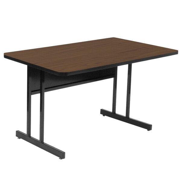 A brown rectangular Correll desk with black metal legs.