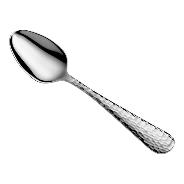 A metal spoon with a polished oval bowl and a textured, hammered handle.