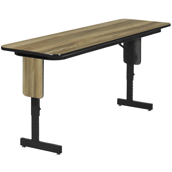 A Correll Colonial Hickory laminate seminar table with a black metal base.