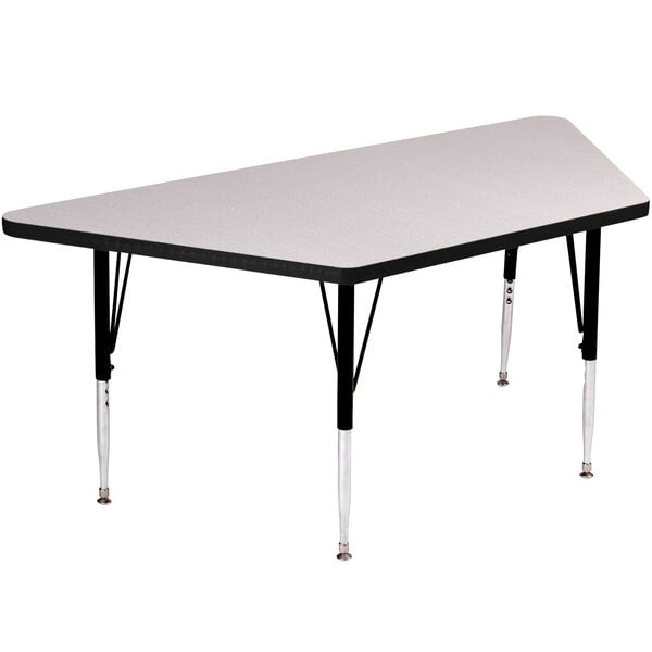 A trapezoid-shaped Correll activity table with black legs.