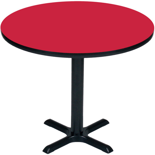 A Correll red bar height table with a black base and a round top.