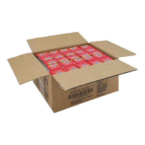 A white box full of red Strawberry Jam portion packets.