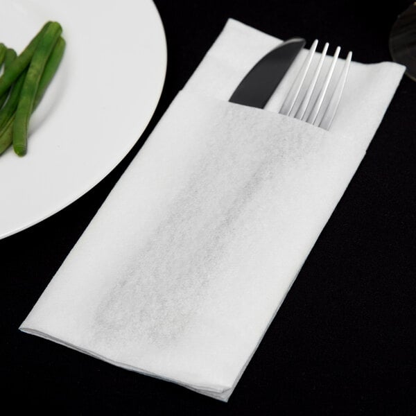 a fork and knife on a napkin