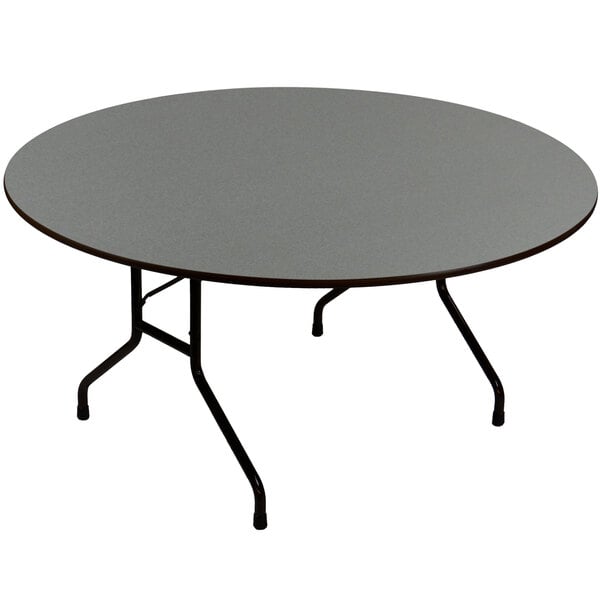 A Correll round table with a black metal frame.