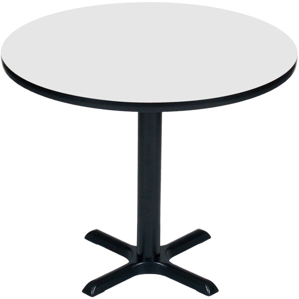 A Correll white round bar height table with a black base.