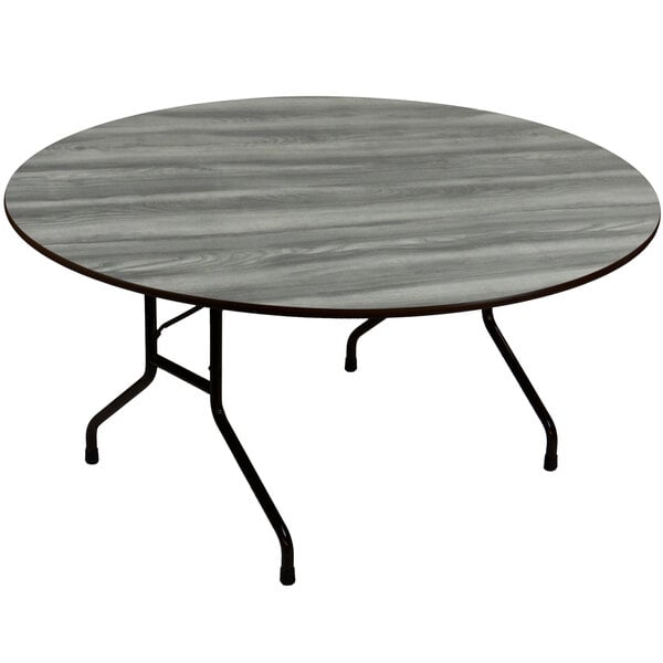 A Correll round folding table with metal legs and a gray top.