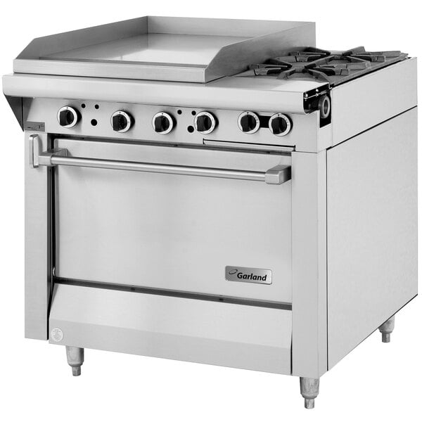 A stainless steel Garland commercial gas range with two burners, a griddle, and an oven.