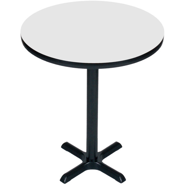 A white round Correll bar height table with a black base.