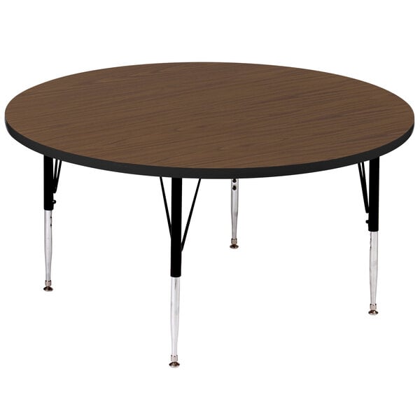 A round walnut activity table with black legs.