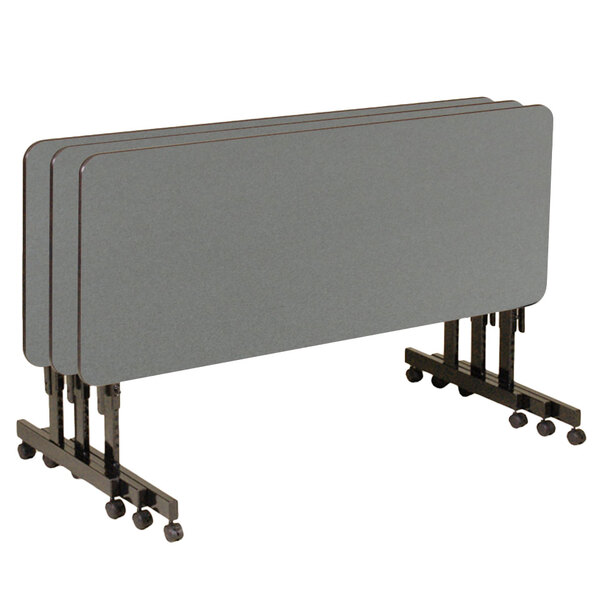 A group of rectangular Correll seminar tables on wheels.